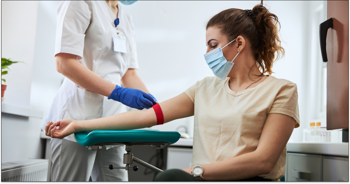 Medical technician performing a blood draw