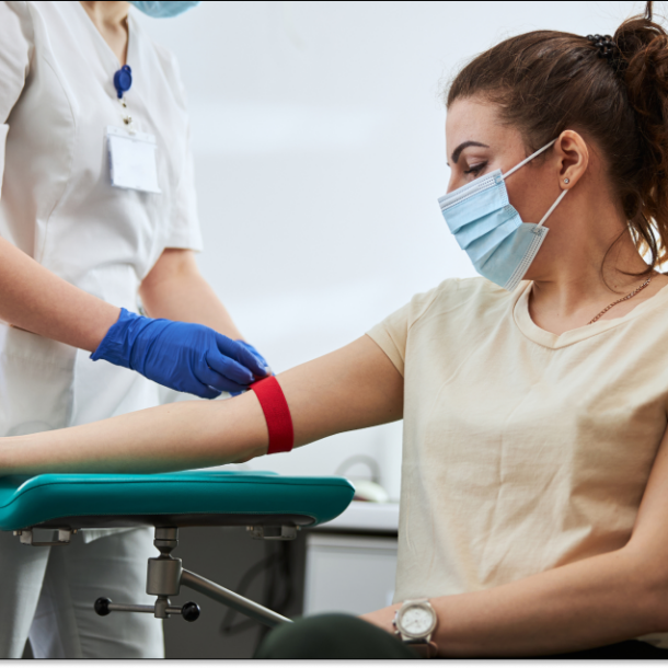 Medical technician performing a blood draw