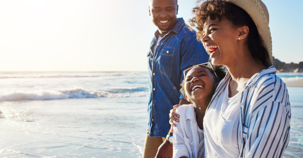 happy family at the beach on a summer vacation